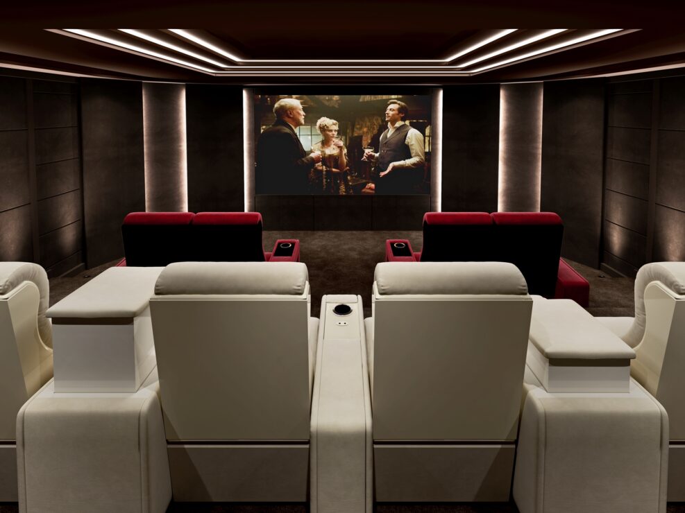 theater at home with beige and red reclining seating