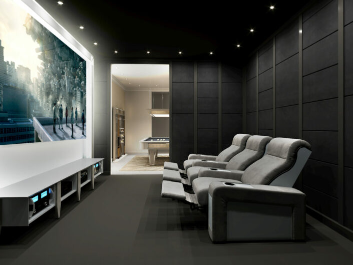 theater at home with three reclining seating and projector screen