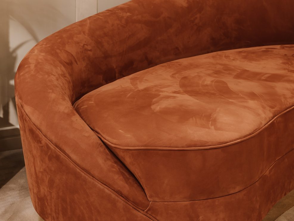 Curved caramel leather sofa