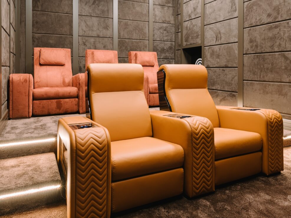 Home theater recliners in orange and red leather